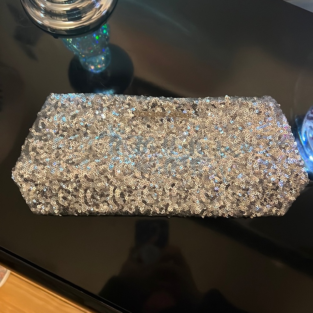 Victoria’s Secret silver sequins clutch with one button top closure